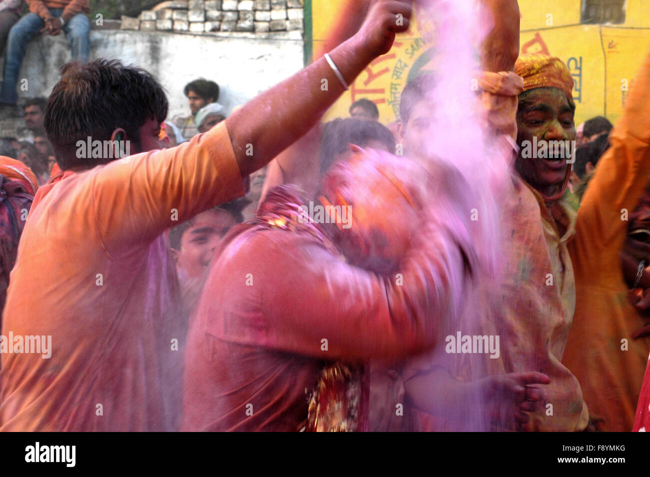 Large number of people gathered sprinkle colored water and powder at Radha Rani Temple at Barsana, Mathura, Uttar Pradesh India. Stock Photo