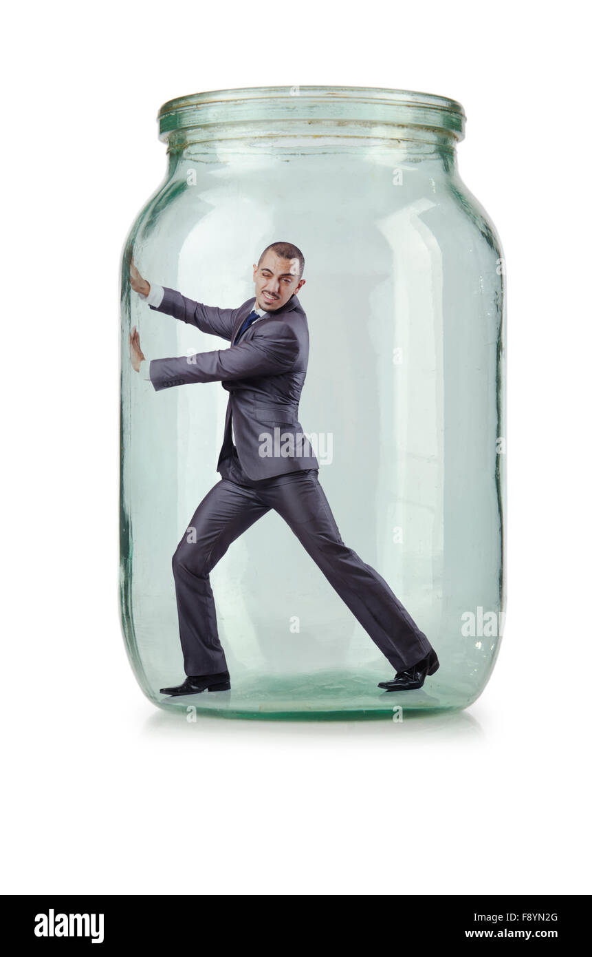 Young businessman in glass jar Stock Photo