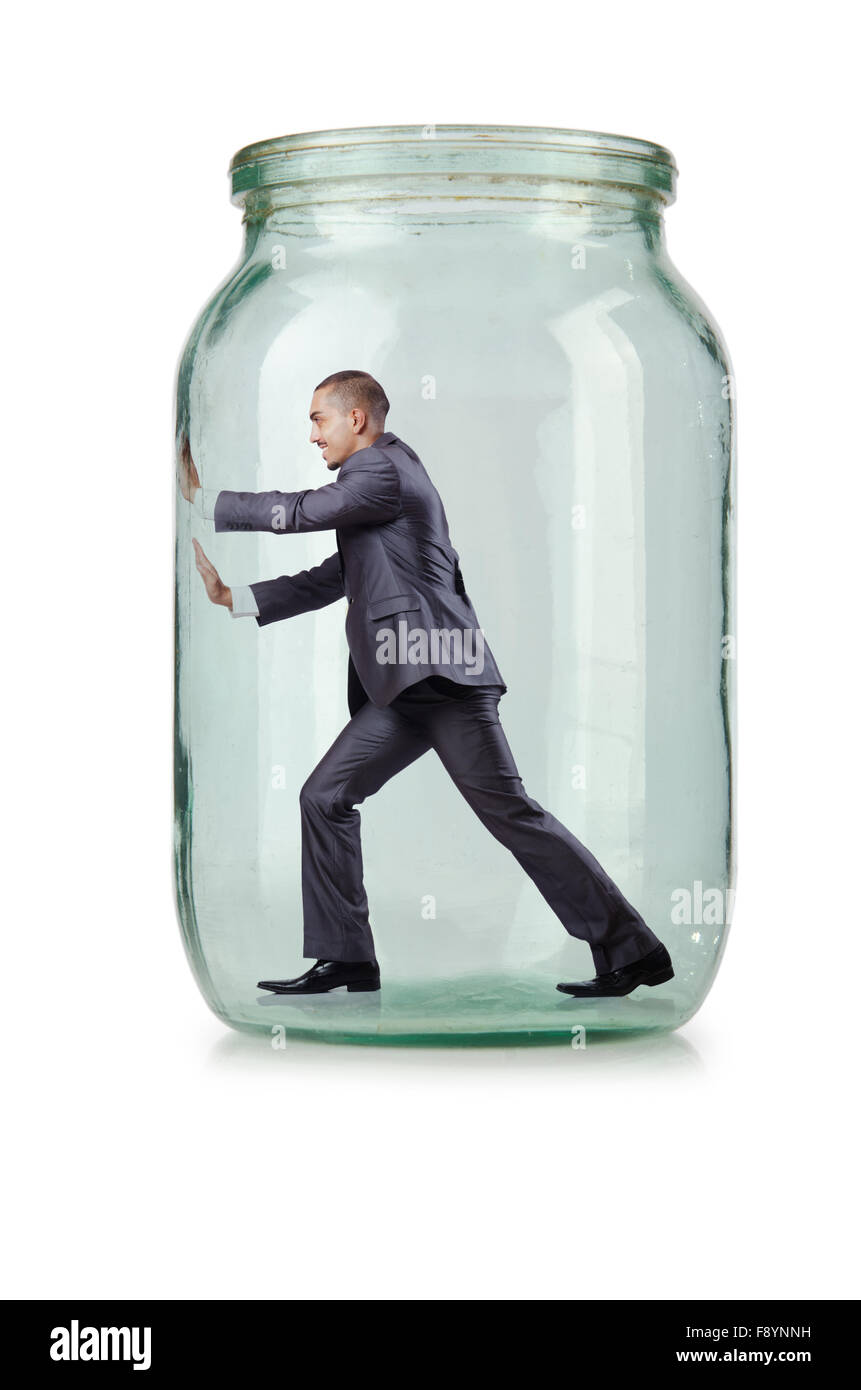 Young businessman in glass jar Stock Photo