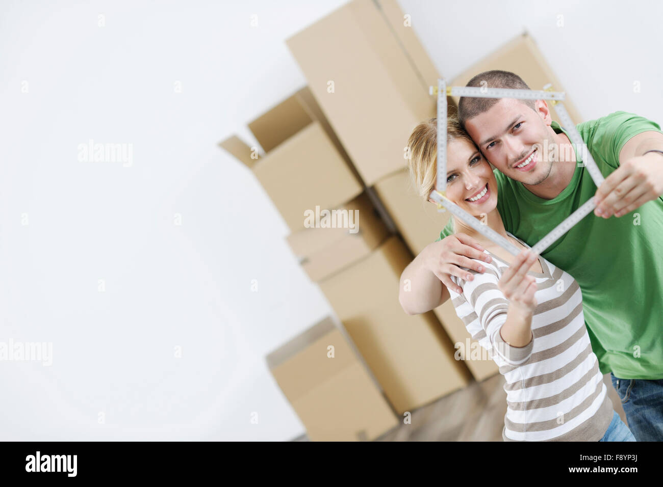 happy Young couple moving in new home Stock Photo - Alamy