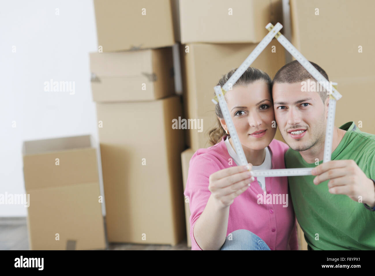 happy Young couple moving in new home Stock Photo - Alamy