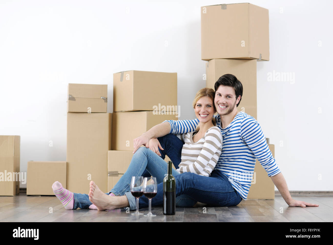 happy Young couple moving in new home Stock Photo - Alamy