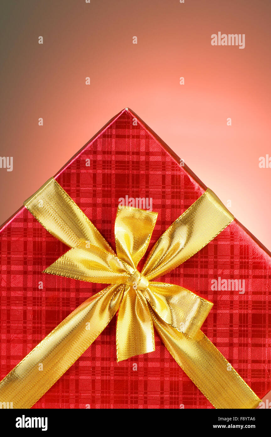 Gift box against gradient background Stock Photo - Alamy