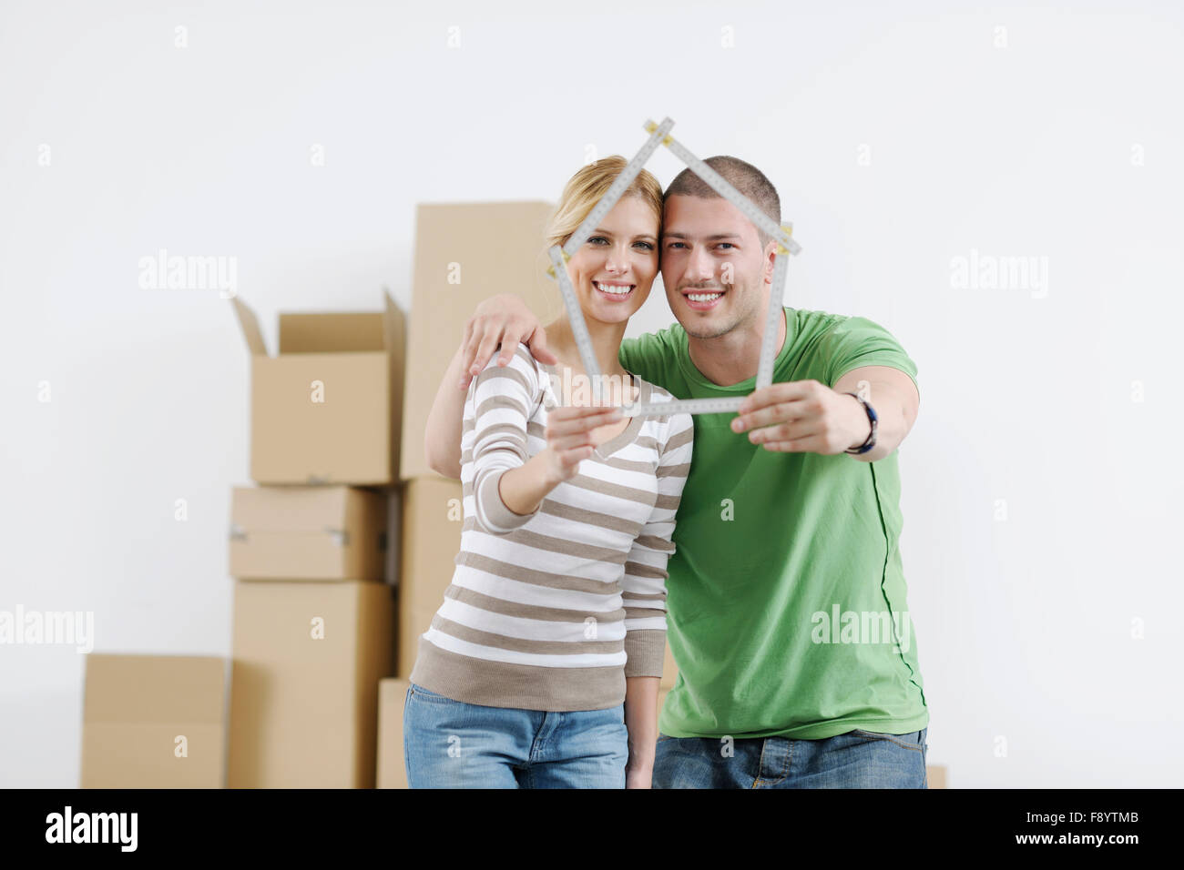 happy Young couple moving in new home Stock Photo - Alamy