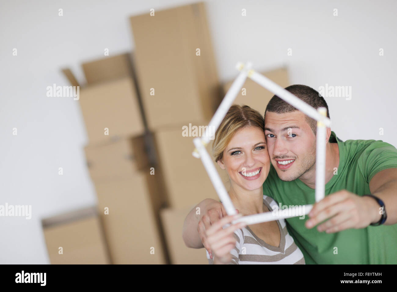 happy Young couple moving in new home Stock Photo - Alamy
