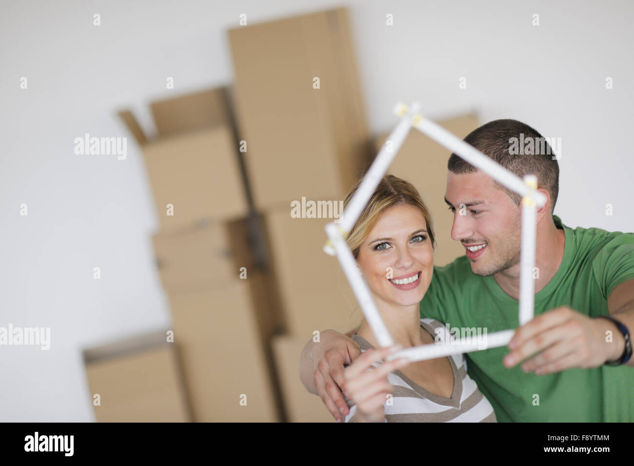 happy Young couple moving in new home Stock Photo - Alamy