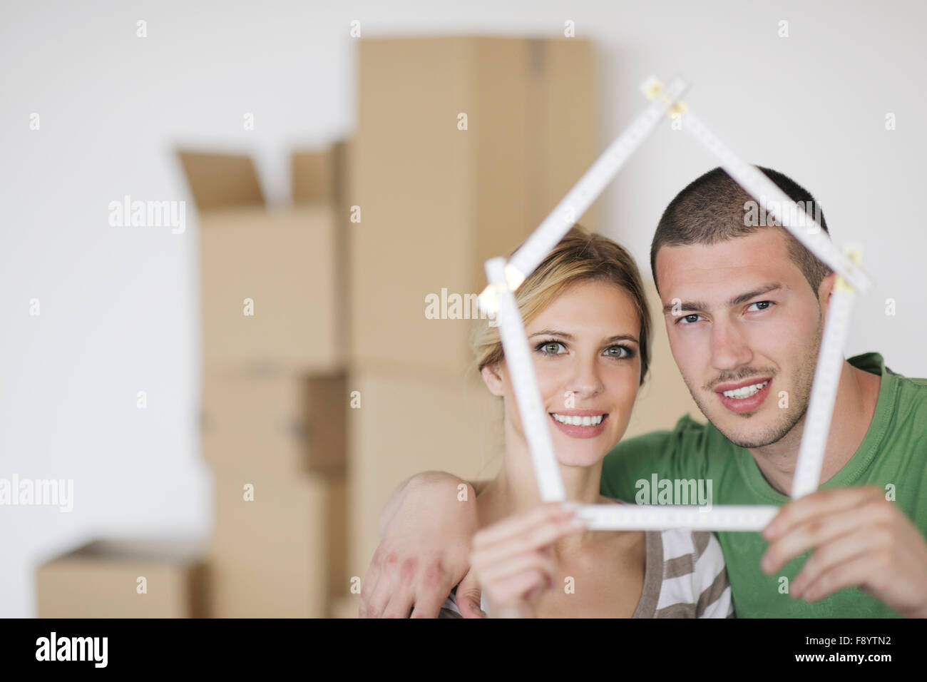 happy Young couple moving in new home Stock Photo - Alamy