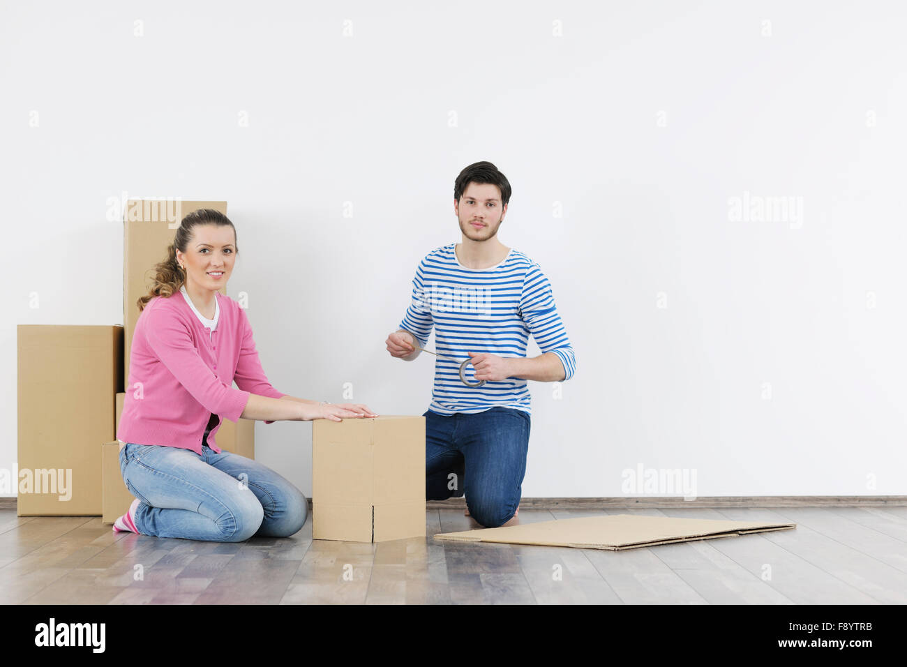 happy Young couple moving in new home Stock Photo - Alamy