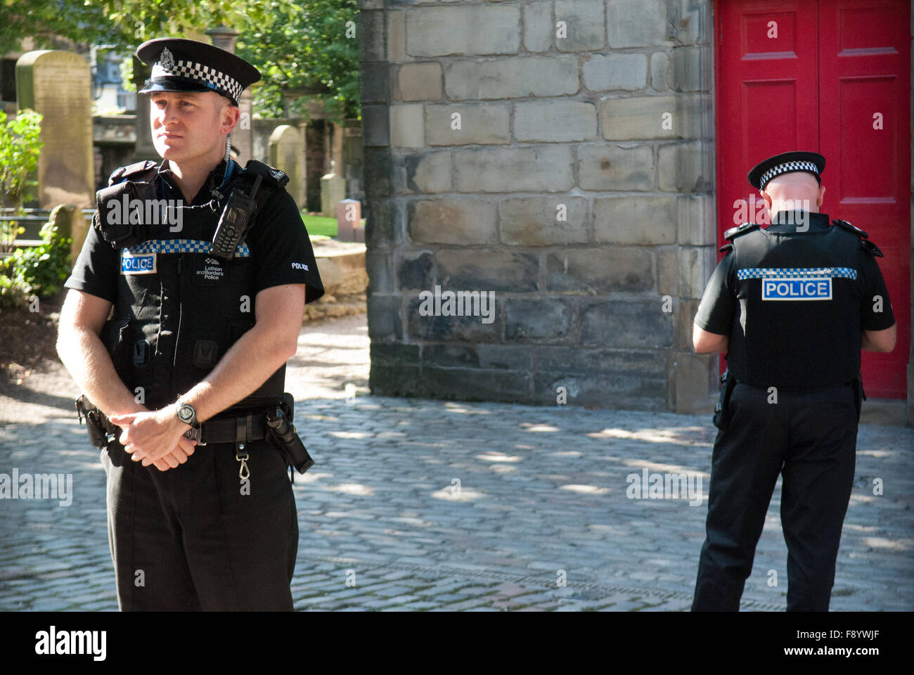 Police outside Canongate Kirk in Edinburgh, Scotland on 29th July 2011 before the wedding of Zara Philips and Mike Tindall. Stock Photo