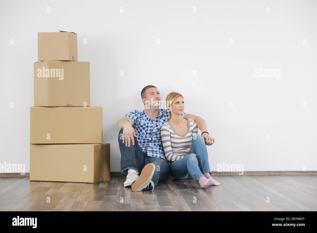 happy Young couple moving in new home Stock Photo - Alamy