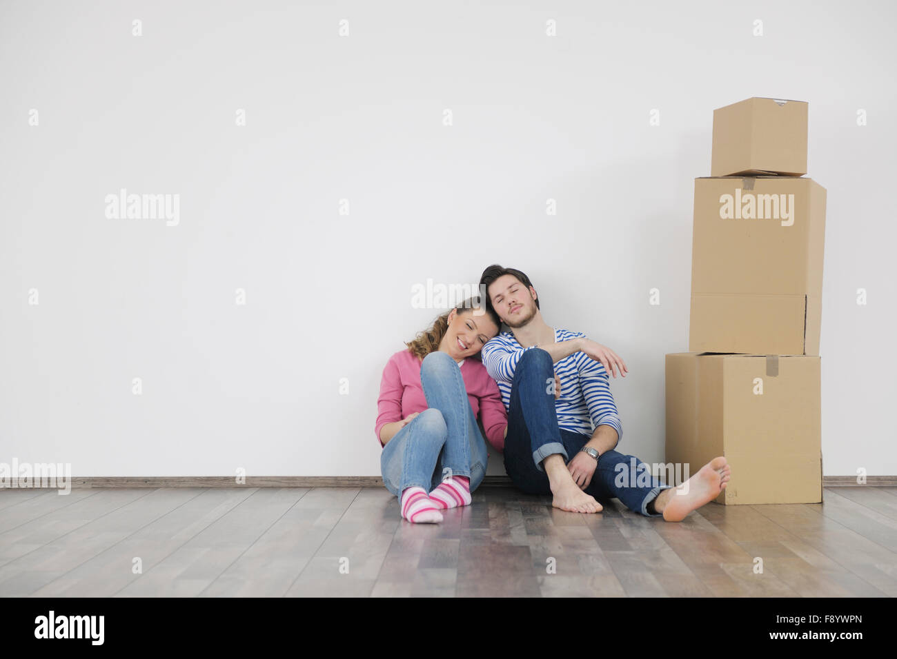happy Young couple moving in new home Stock Photo - Alamy