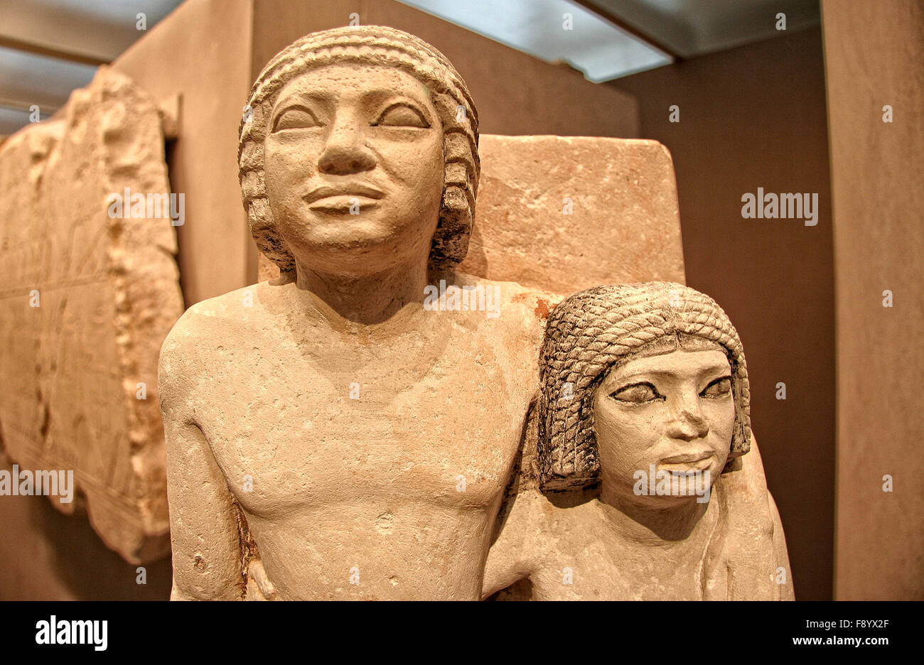 Egyptian limestone Old Kingdom statue of a couple for their tomb Stock Photo