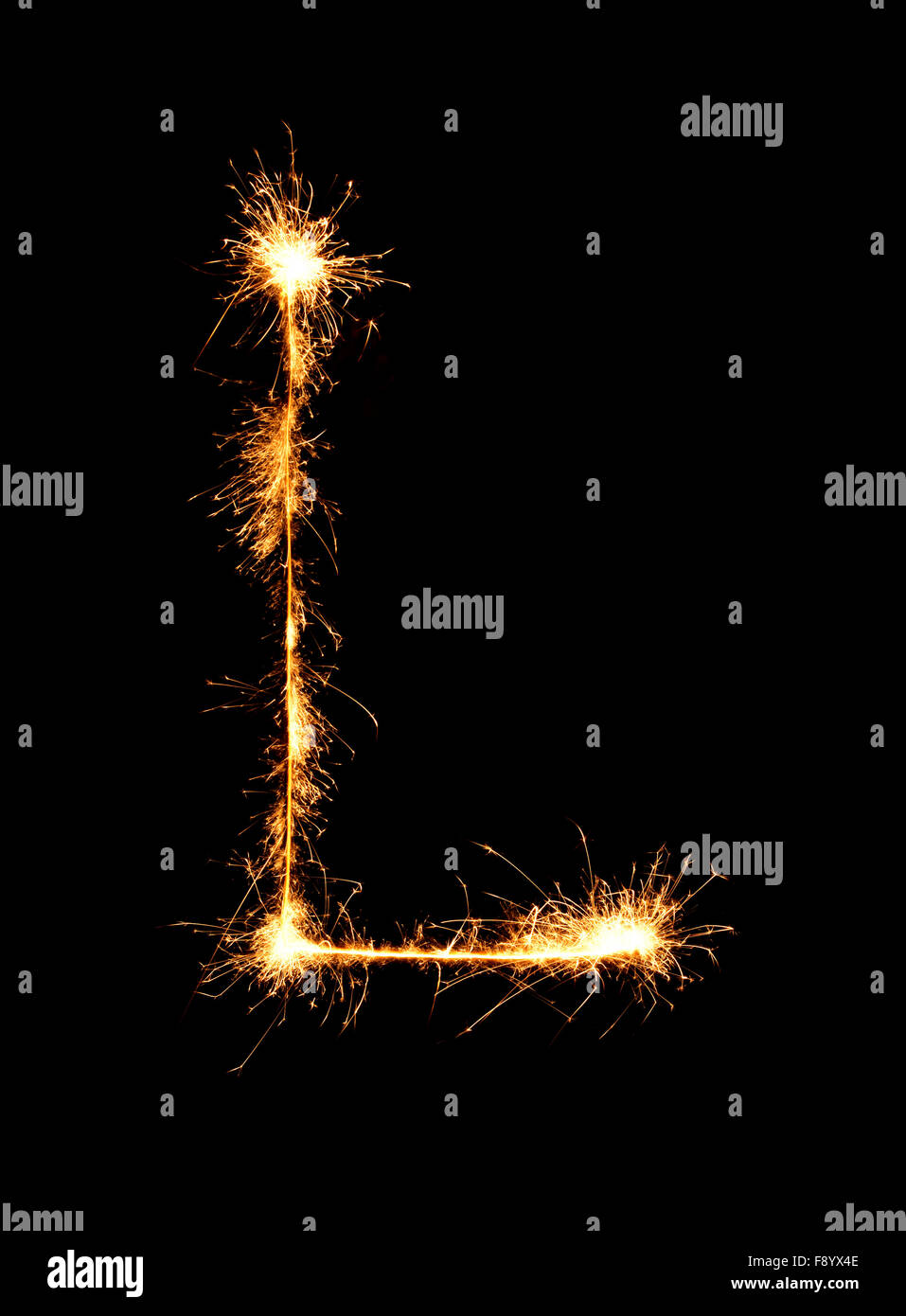 Sparkler firework light alphabet L (Capital Letters) at night background Stock Photo