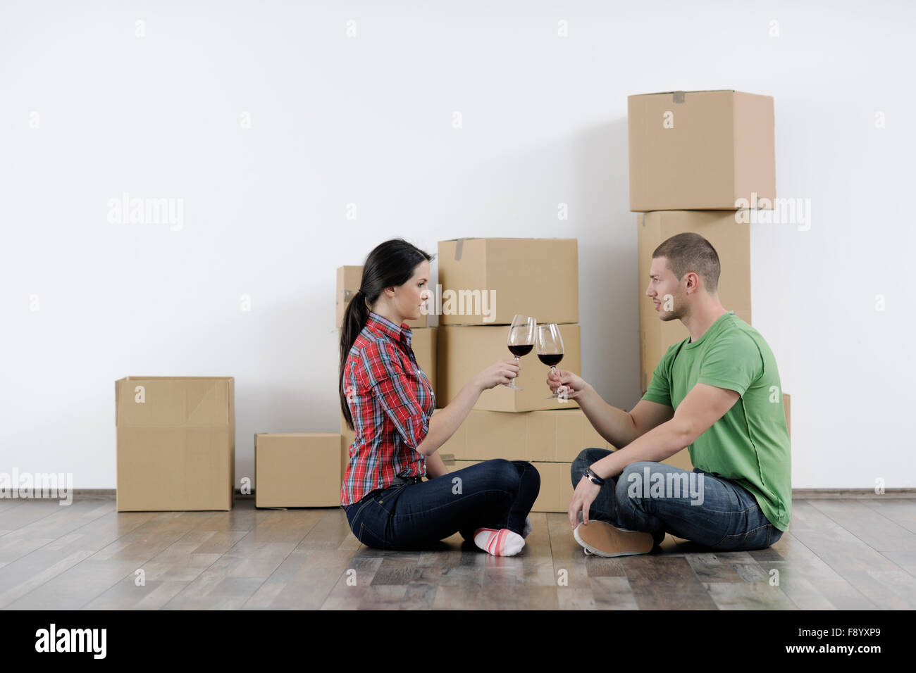happy Young couple moving in new home Stock Photo - Alamy