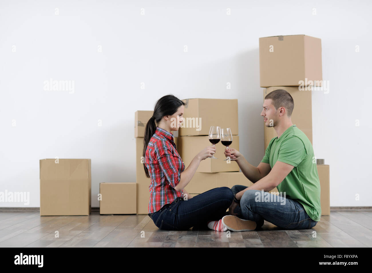 happy Young couple moving in new home Stock Photo - Alamy