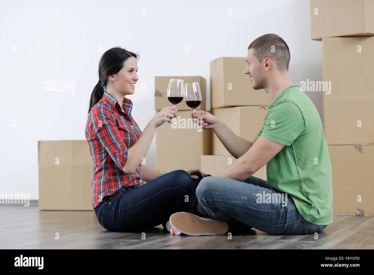 happy Young couple moving in new home Stock Photo - Alamy
