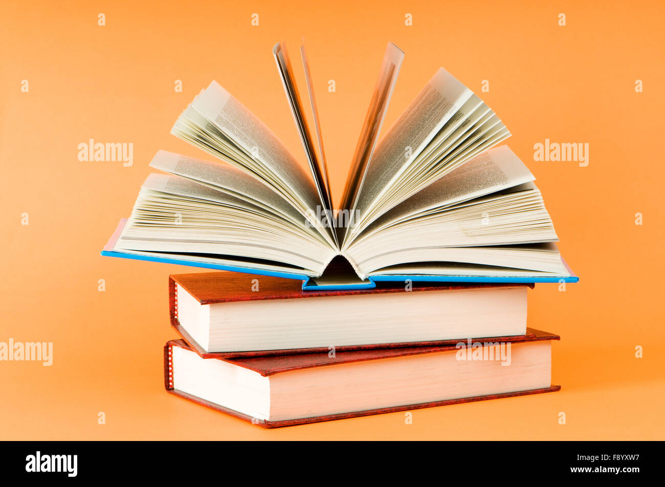 Stack of books on the color background Stock Photo