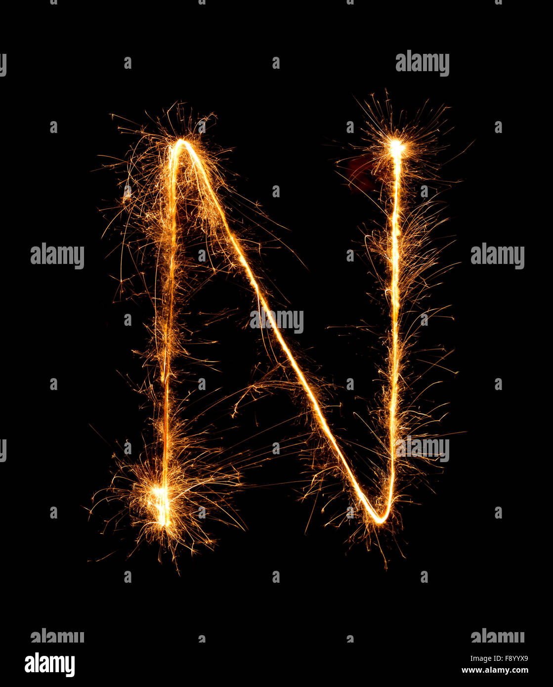 Sparkler firework light alphabet N (Capital Letters) at night background Stock Photo