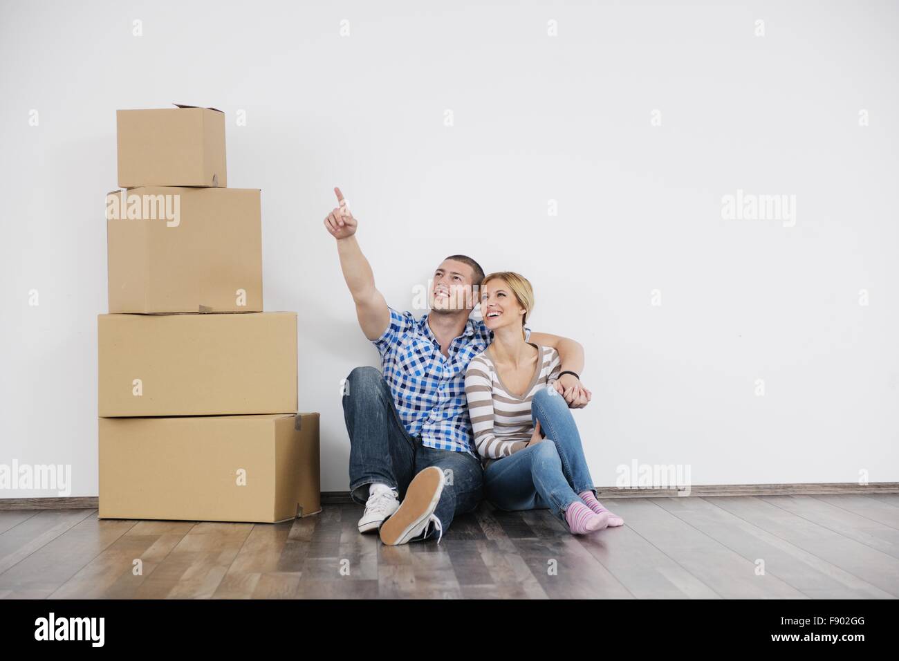 happy Young couple moving in new home Stock Photo - Alamy