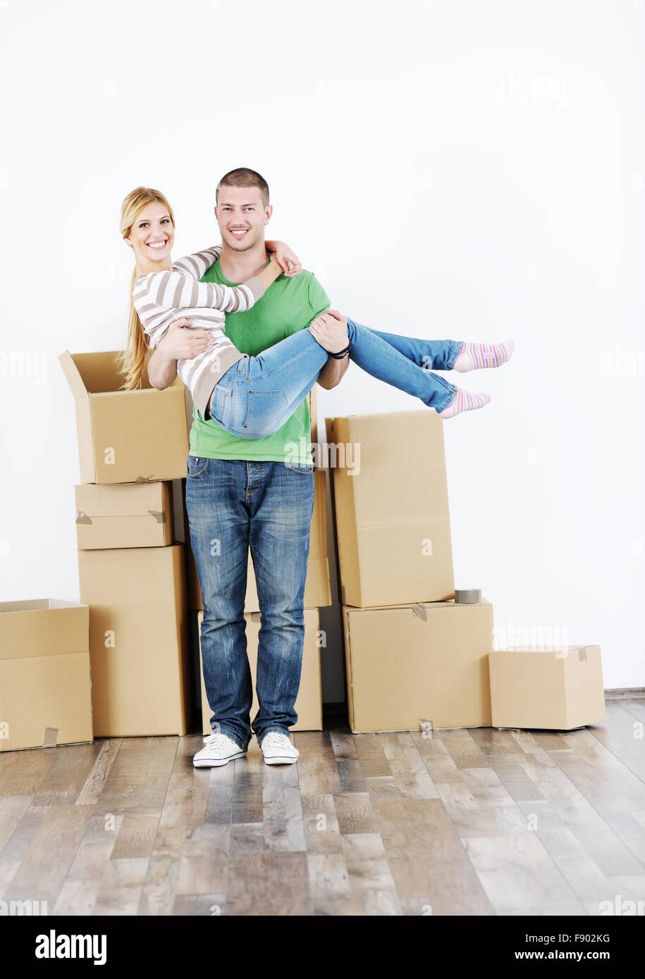 happy Young couple moving in new house Stock Photo - Alamy