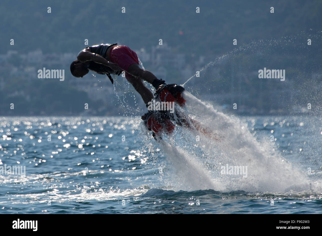Flyboarder in pink shorts diving to left Stock Photo Alamy