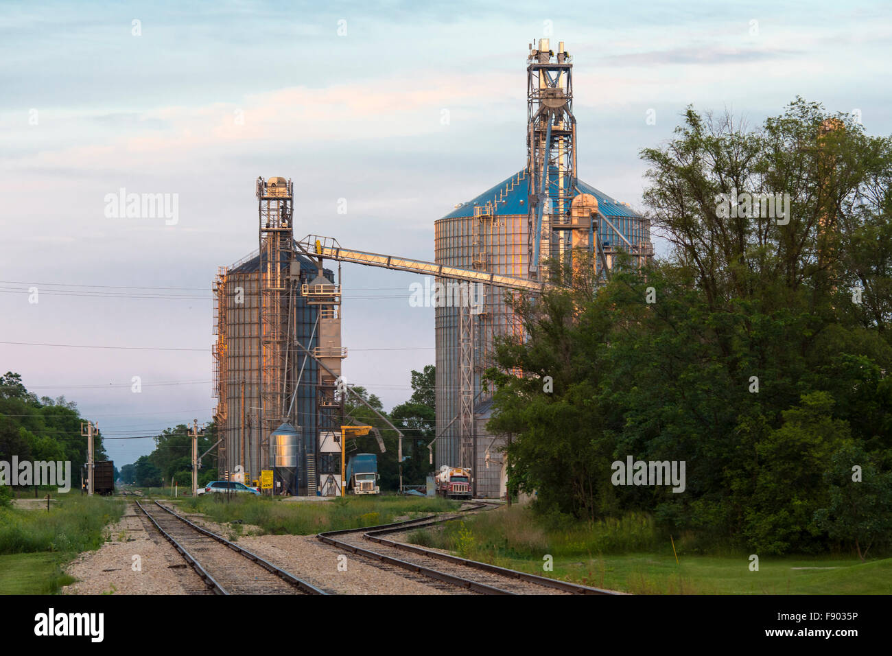 Grain storage silos along railroad tracks in Muscoda Wisconsin Stock Photo