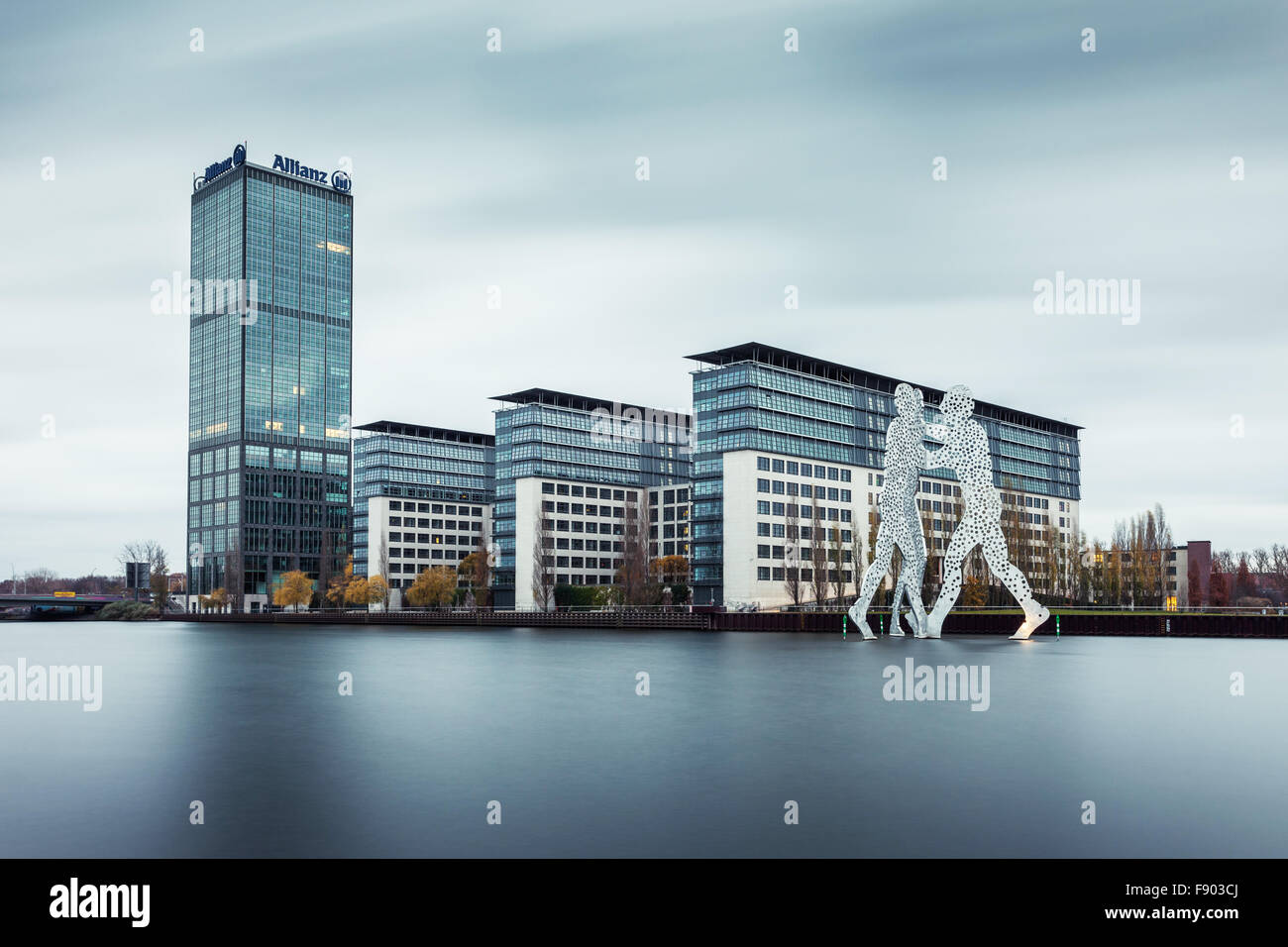 Treptowers with Allianz Tower by the River Spree, Molecule Man sculpture by the artist Jonathan Borofsky, Treptow, Berlin Stock Photo