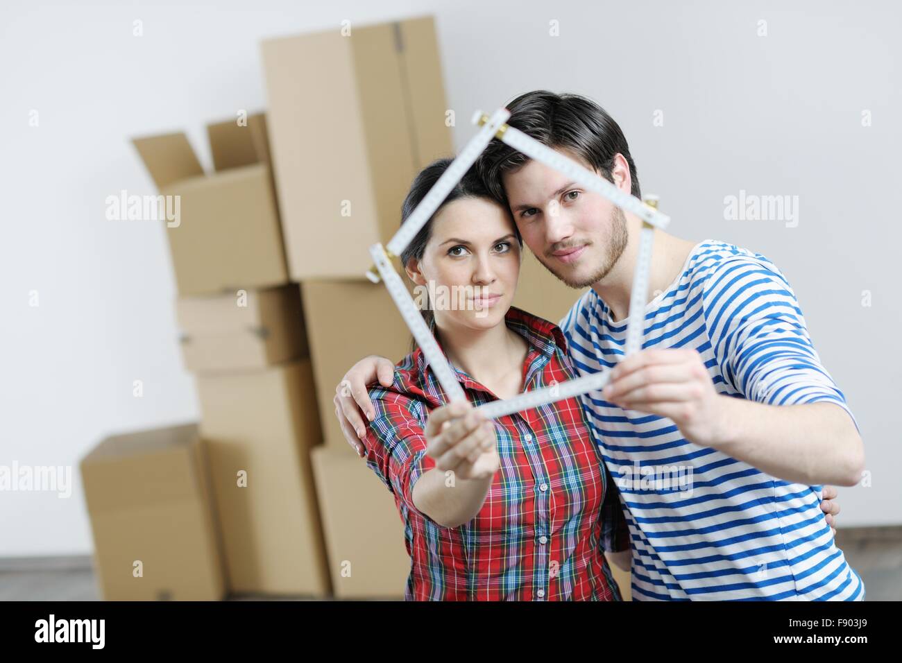 happy Young couple moving in new house Stock Photo - Alamy