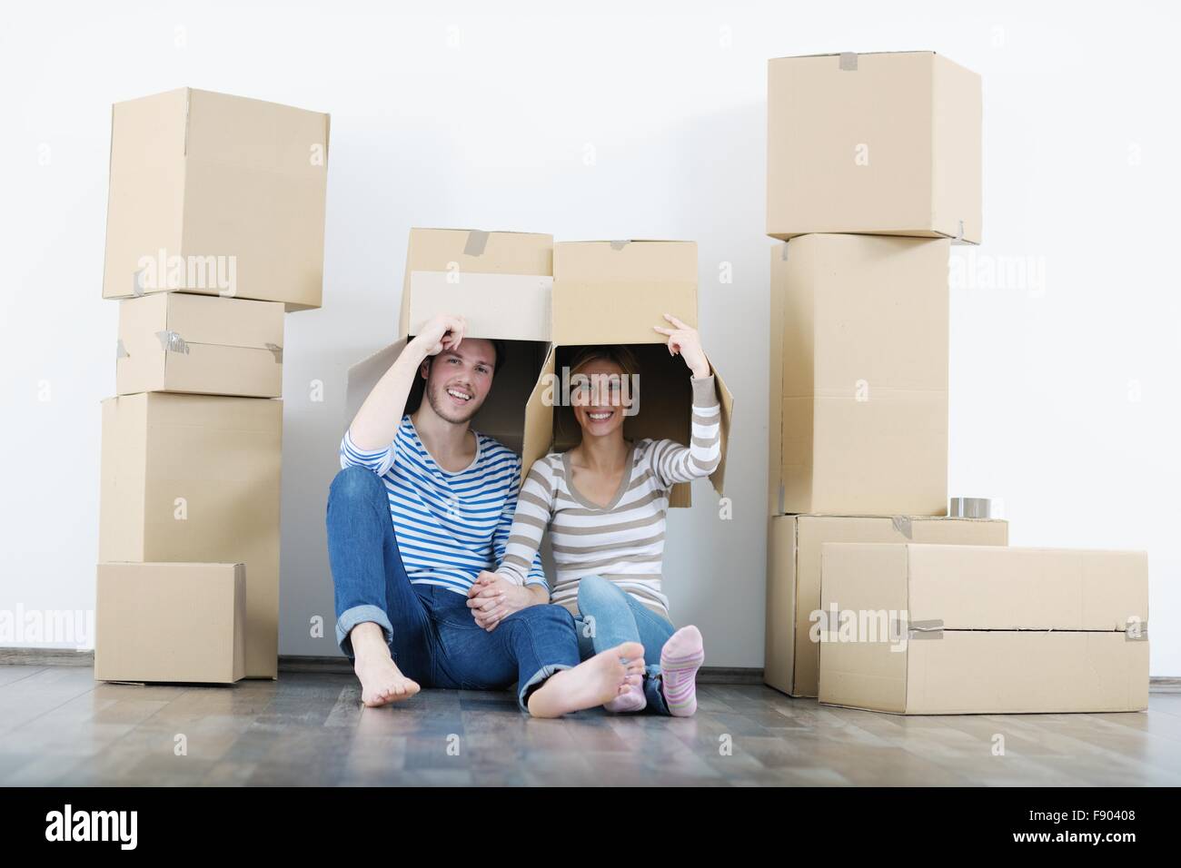 happy Young couple moving in new house Stock Photo - Alamy