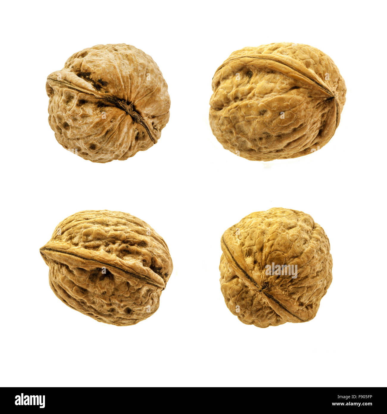 Four walnuts isolated white background hi-res stock photography and ...