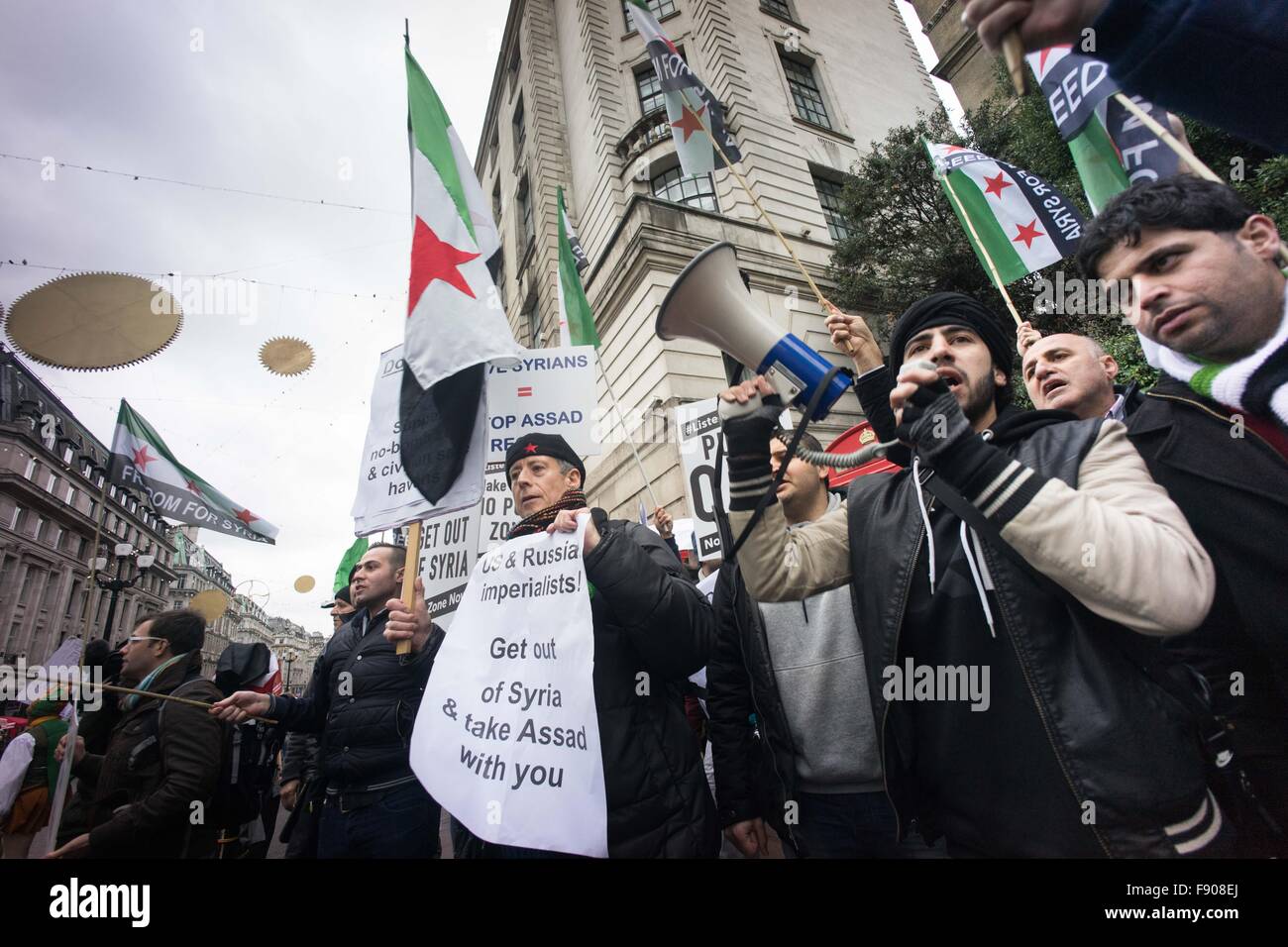 London, United Kingdom. 12th Dec, 2015. Free Syrian Army supporters seen in 'Stop Bombing Syria' demonstration. - Thousand of protesters took part in anti war demonstration march and rally organized by the Stop The War Coalition in Central London to demand the British government to stop its air strike military action in Syria which started two weeks ago. Ethic Syrians who are anti Assad regime and pro Free Syrian Army supporters also took part in the demonstration. Credit:  Geovin So/Pacific Press/Alamy Live News Stock Photo