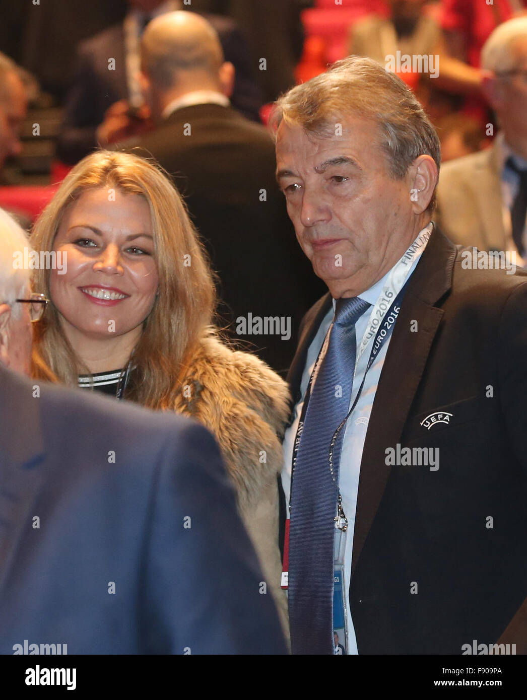 Paris, France. 12th Dec, 2015. Wolfgang Niersbach, former president of Germany's soccer association (DFB), and his partner Marion Popp arrive to the UEFA EURO 2016 final draw ceremony at the Palais des Congrès in Paris, France, 12 December 2015. The UEFA EURO 2016 soccer championship will take place from 10 June to 10 July 2016 in France. Photo: Christian Charisius/dpa/Alamy Live News Stock Photo