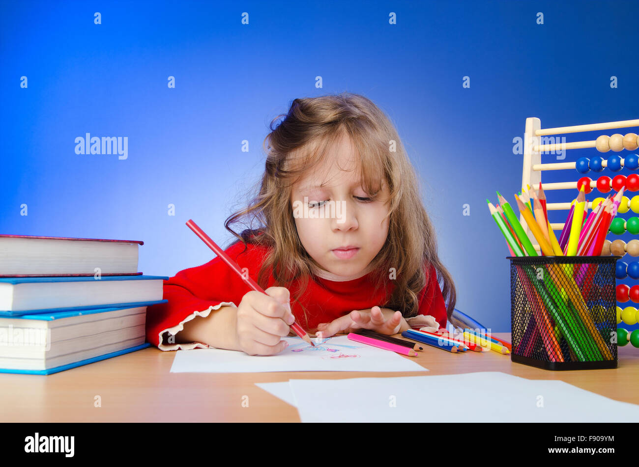 Little girl drawing with pencils Stock Photo - Alamy
