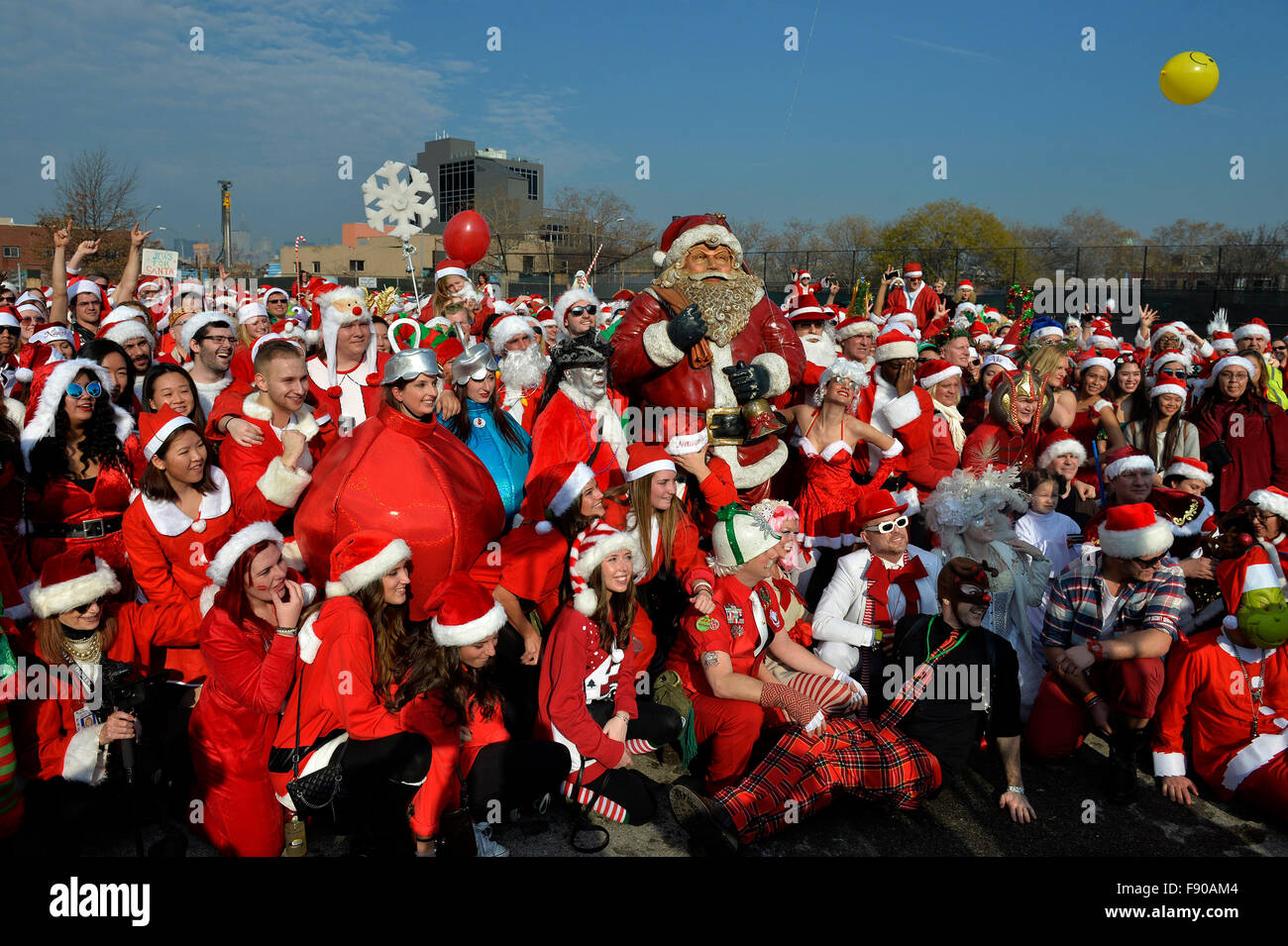 New York, USA. 12th Dec, 2015. People dressed as Santa Claus take part in SantaCon 2015 in New York, the United States, on Dec. 12, 2015. SantaCon 2015 kicked off Saturday here in New York. SantaCon, a celebration that calls for attendees to dress as Santas and follow a pre-planned route of bar-hopping, is celebrated in cities across the U.S. and the world. Credit:  Wang Lei/Xinhua/Alamy Live News Stock Photo