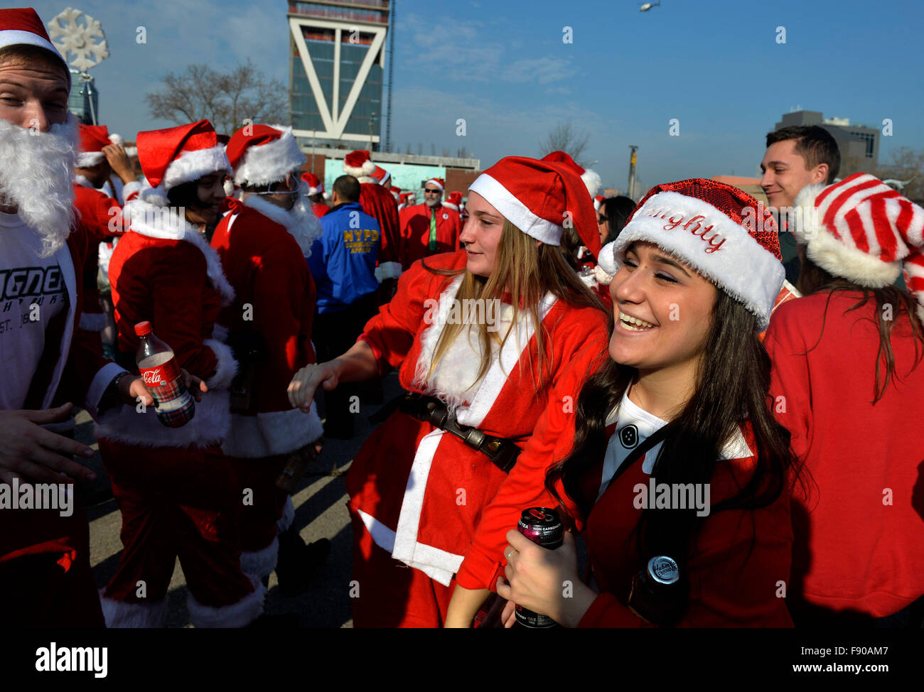 New York, USA. 12th Dec, 2015. People dressed as Santa Claus take part in SantaCon 2015 in New York, the United States, on Dec. 12, 2015. SantaCon 2015 kicked off Saturday here in New York. SantaCon, a celebration that calls for attendees to dress as Santas and follow a pre-planned route of bar-hopping, is celebrated in cities across the U.S. and the world. Credit:  Wang Lei/Xinhua/Alamy Live News Stock Photo