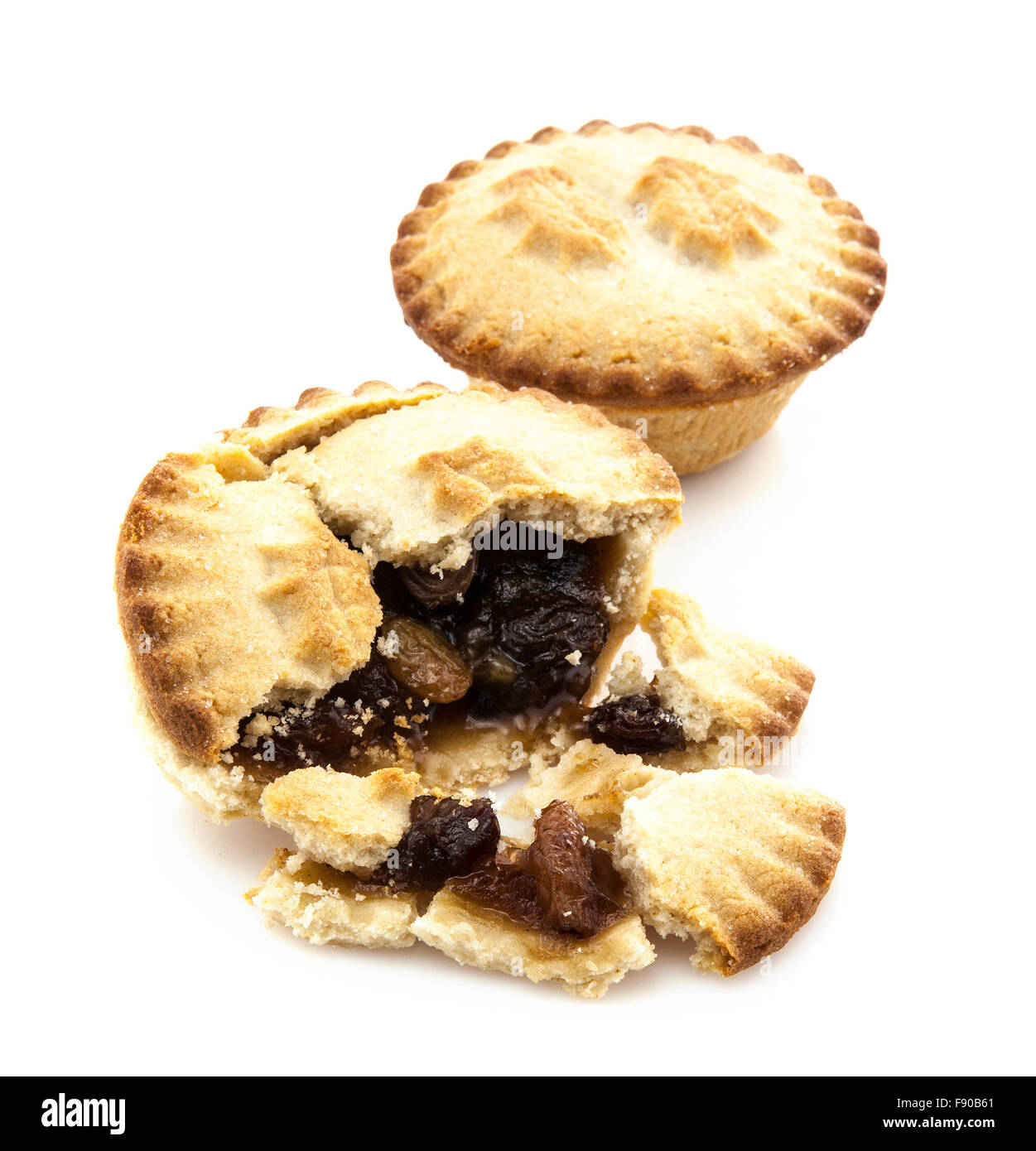 Mince Pie broken in half showing mince on white background Stock Photo ...