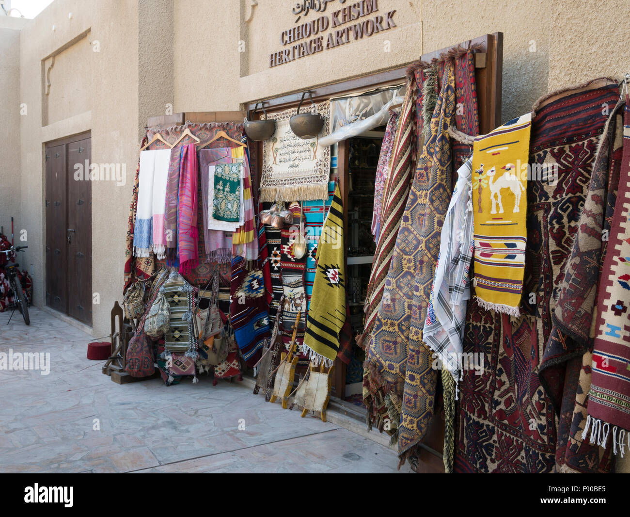 Display of rugs in Dubai heritage area souk (market Stock Photo Alamy