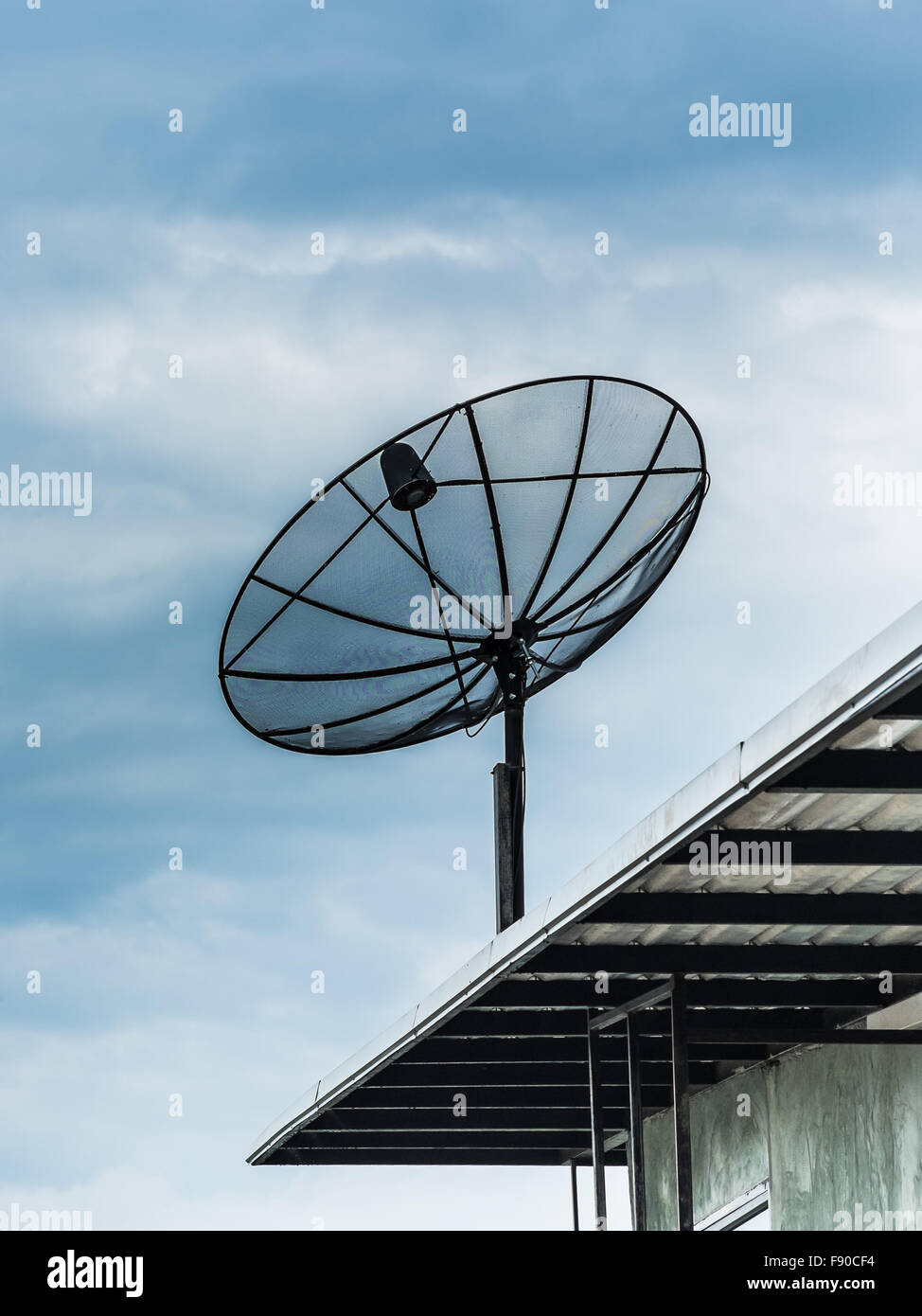 Satellite dish on blue sky background Stock Photo