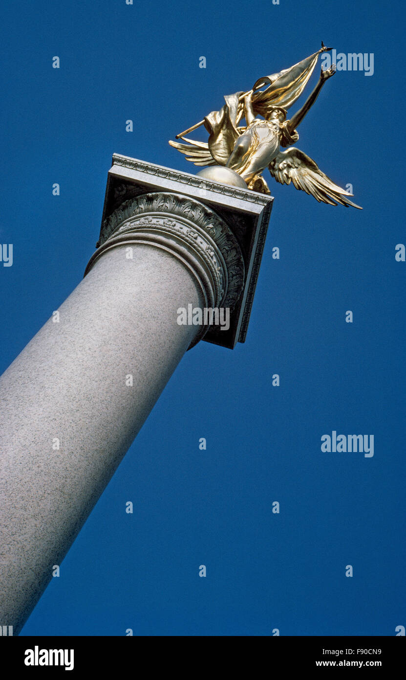 A soaring granite column topped by a gilded bronze statue of the winged figure of Victory is the First Division Monument in Washington, D.C., that honors members of 1st Infantry Division of the U.S. Army who died in World War I and following wars. The 78-foot tall memorial was dedicated in 1924 with the names of 5,516 soldiers killed in Europe between 1917-1919.  In later years, additions were made to the monument with the names of 1st Division men who lost their lives in World War II, the Vietnam War, and Desert Storm. Stock Photo
