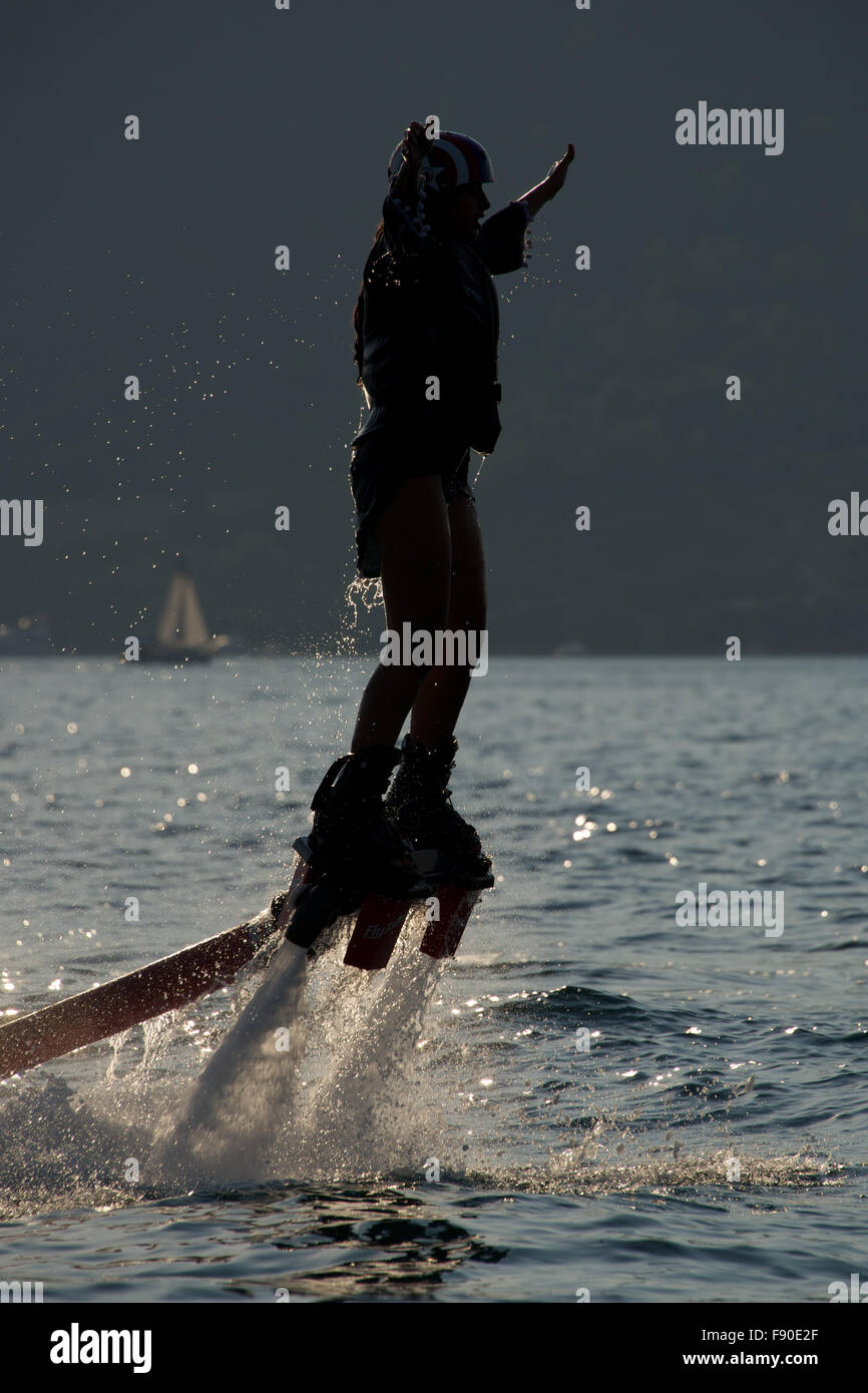 Flyboarder in profile with arms held out Stock Photo Alamy