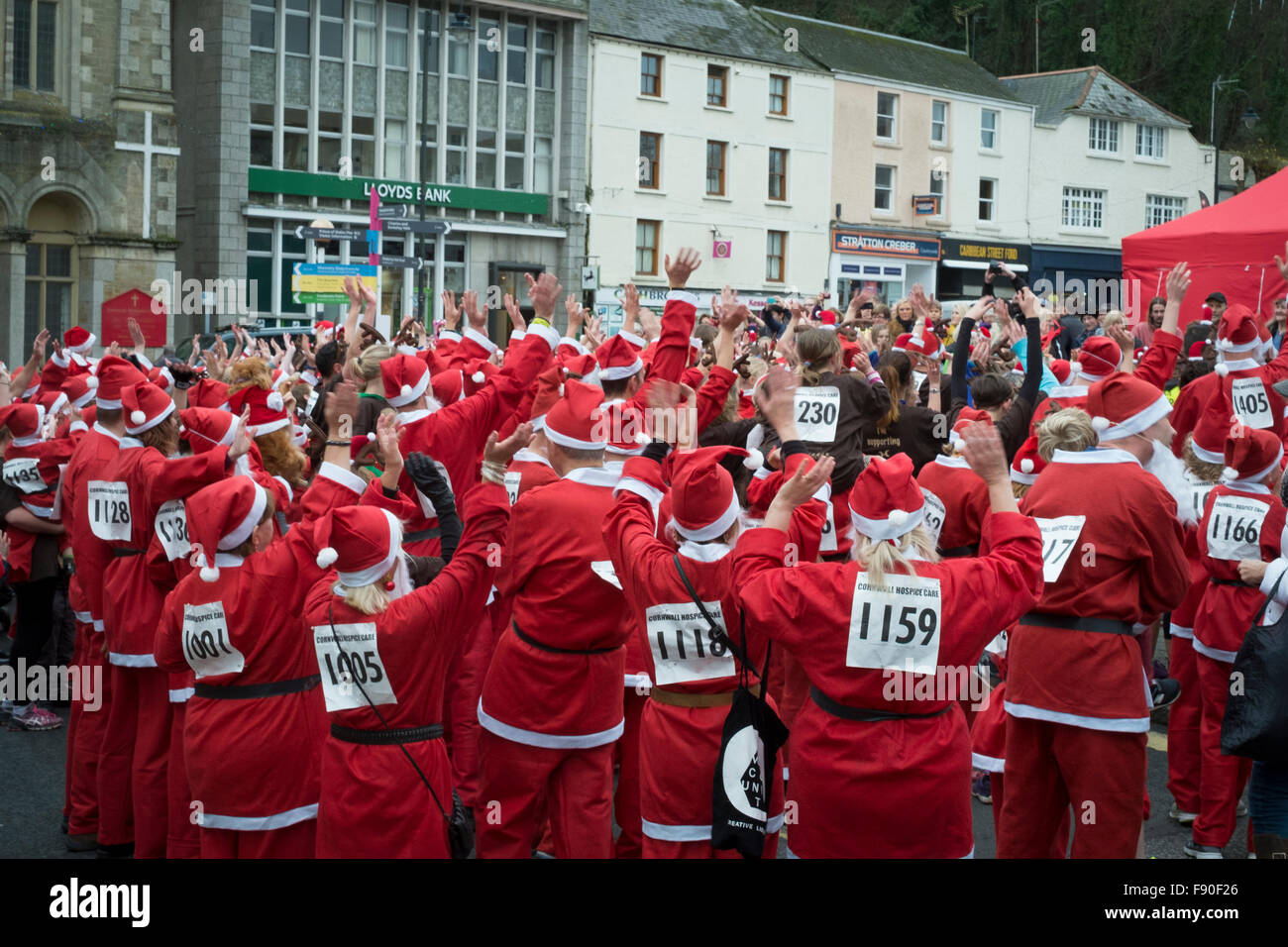 Falmouth, UK. 12th December, 2015. 100's of people took part in the Santa vs Rudolph fun run through Falmouth.  This is one in a series of 7 run, walk and surf events in the Santa series raising funds and awareness to support Cornwall Hospice Care. Credit:  Mick Buston/Alamy Live News Stock Photo