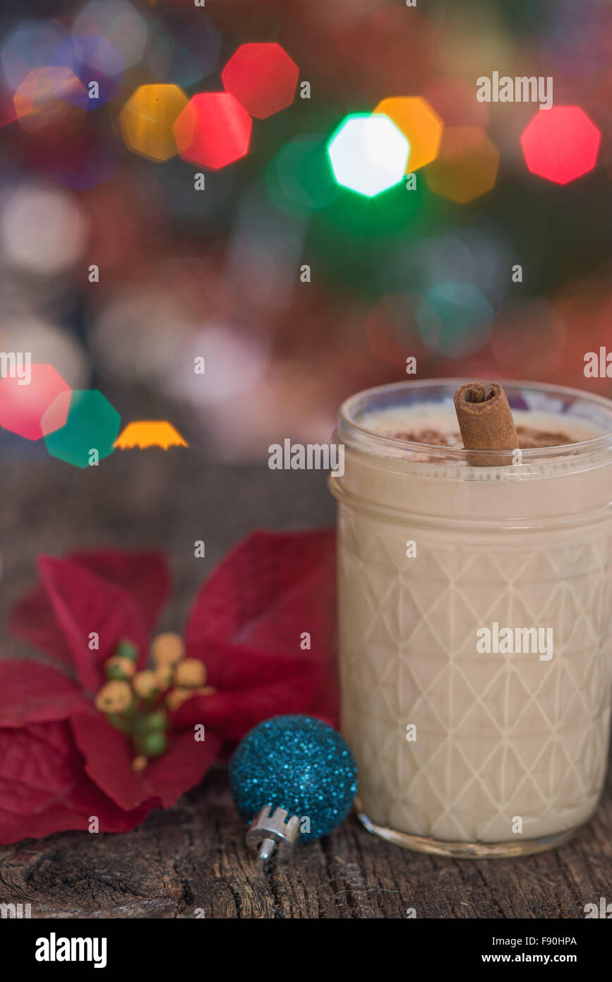 Christmas eggnog with a cinnamon stick Stock Photo