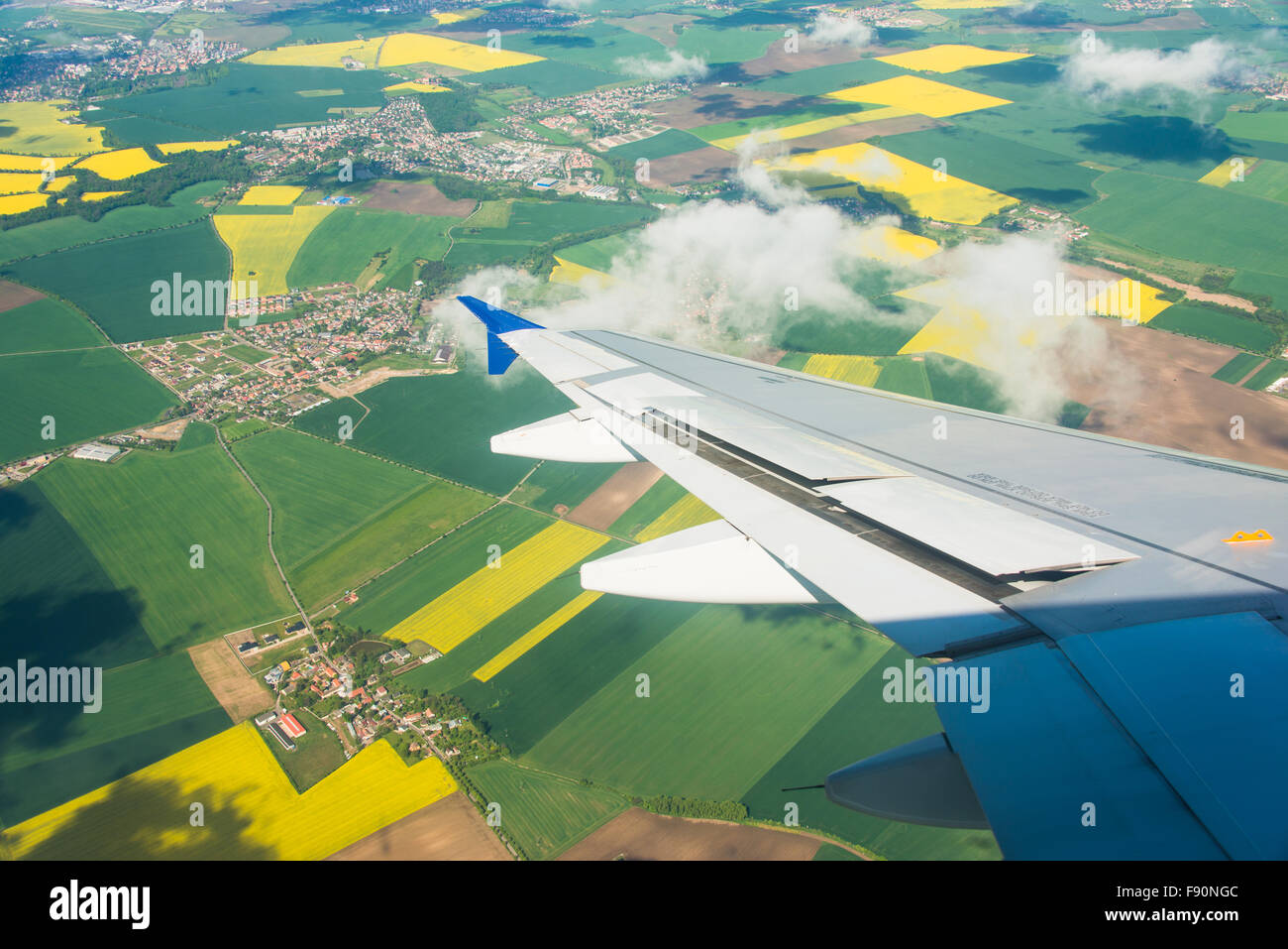 Airplane wing out of window Stock Photo