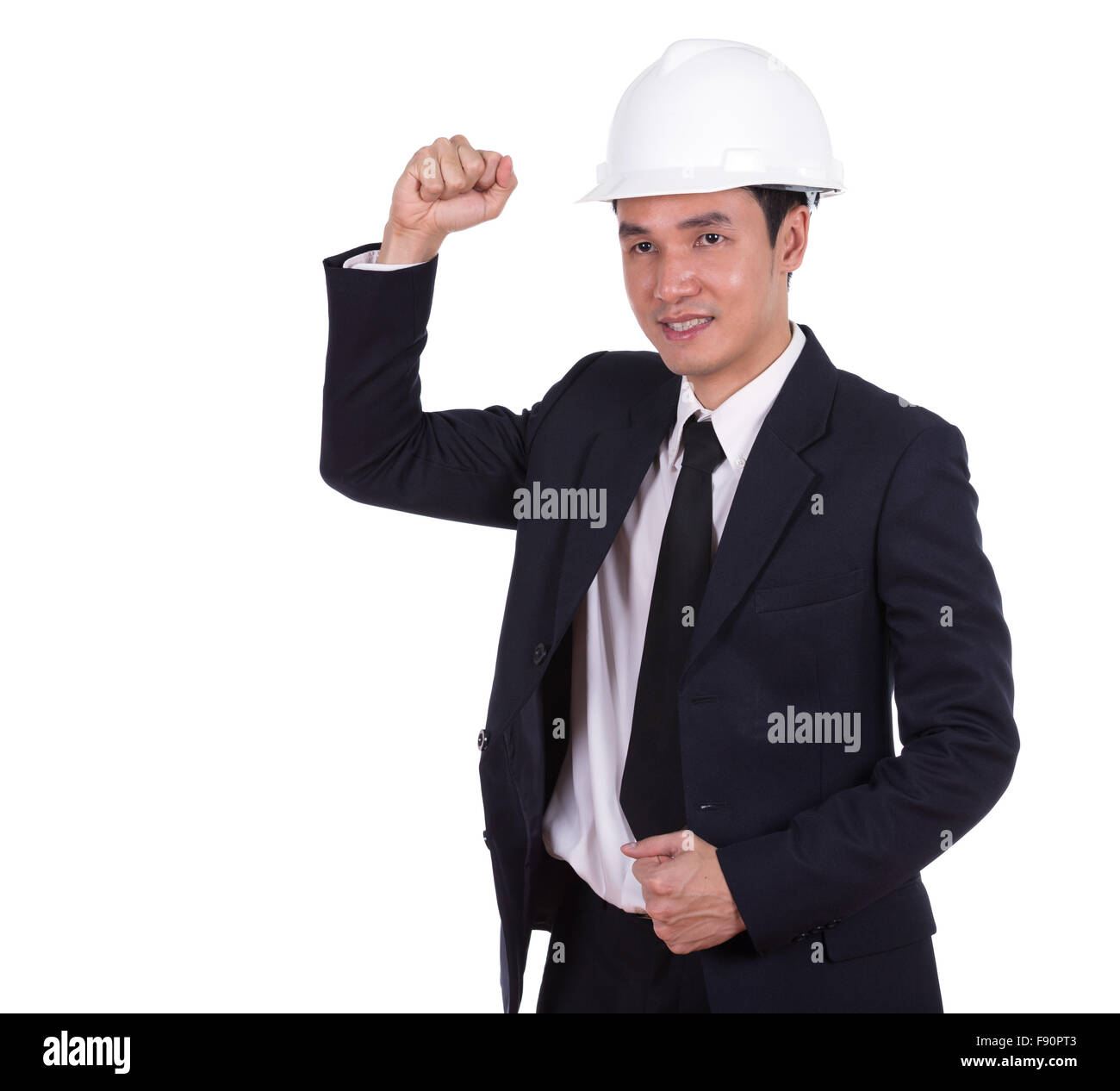Happy young engineer celebrating with arm raised, concept of successful ...