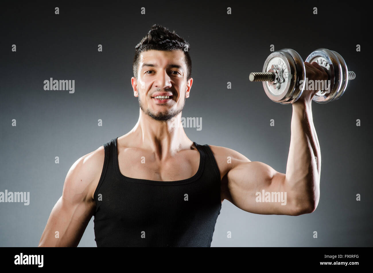 Muscular ripped bodybuilder with dumbbells Stock Photo - Alamy