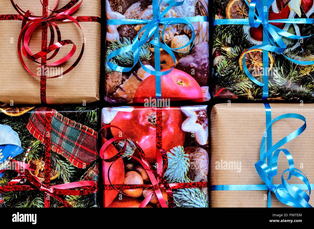 Christmas background with gifts. Gifts in decorative paper and ribbons. Stock Photo