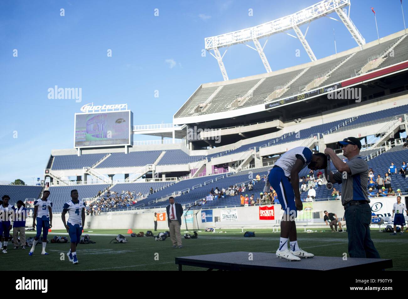 Florida, USA. 12th Dec, 2015. Zack Wittman | Times.Armwood's Moses Wells receives his silver medal after losing 13-48 to Miami Central after Armwood High School's game against Miami Central Senior High School in the Class 6A 2015 FHSAA Football Finals on Saturday afternoon, December 12, 2015 at the Citrus Bowl in Orlando. © Tampa Bay Times/ZUMA Wire/Alamy Live News Stock Photo