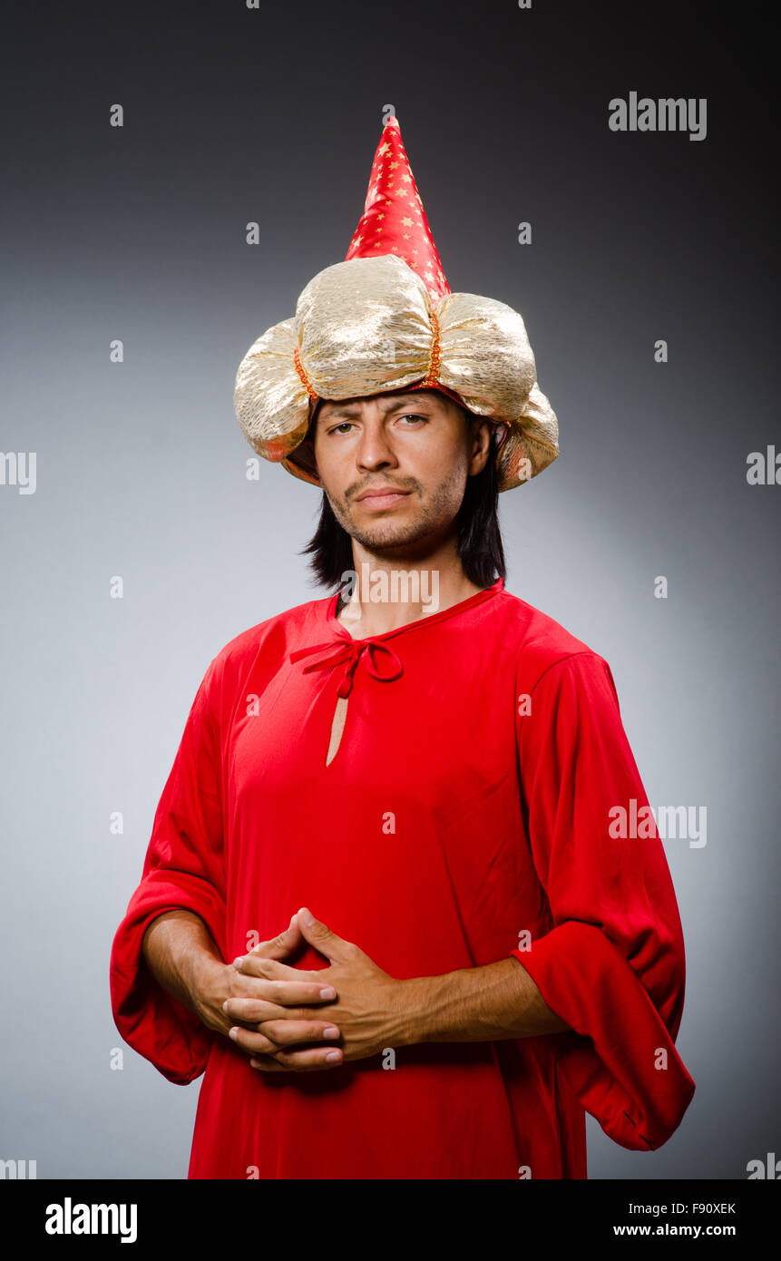 Funny wizard wearing red dress Stock Photo - Alamy