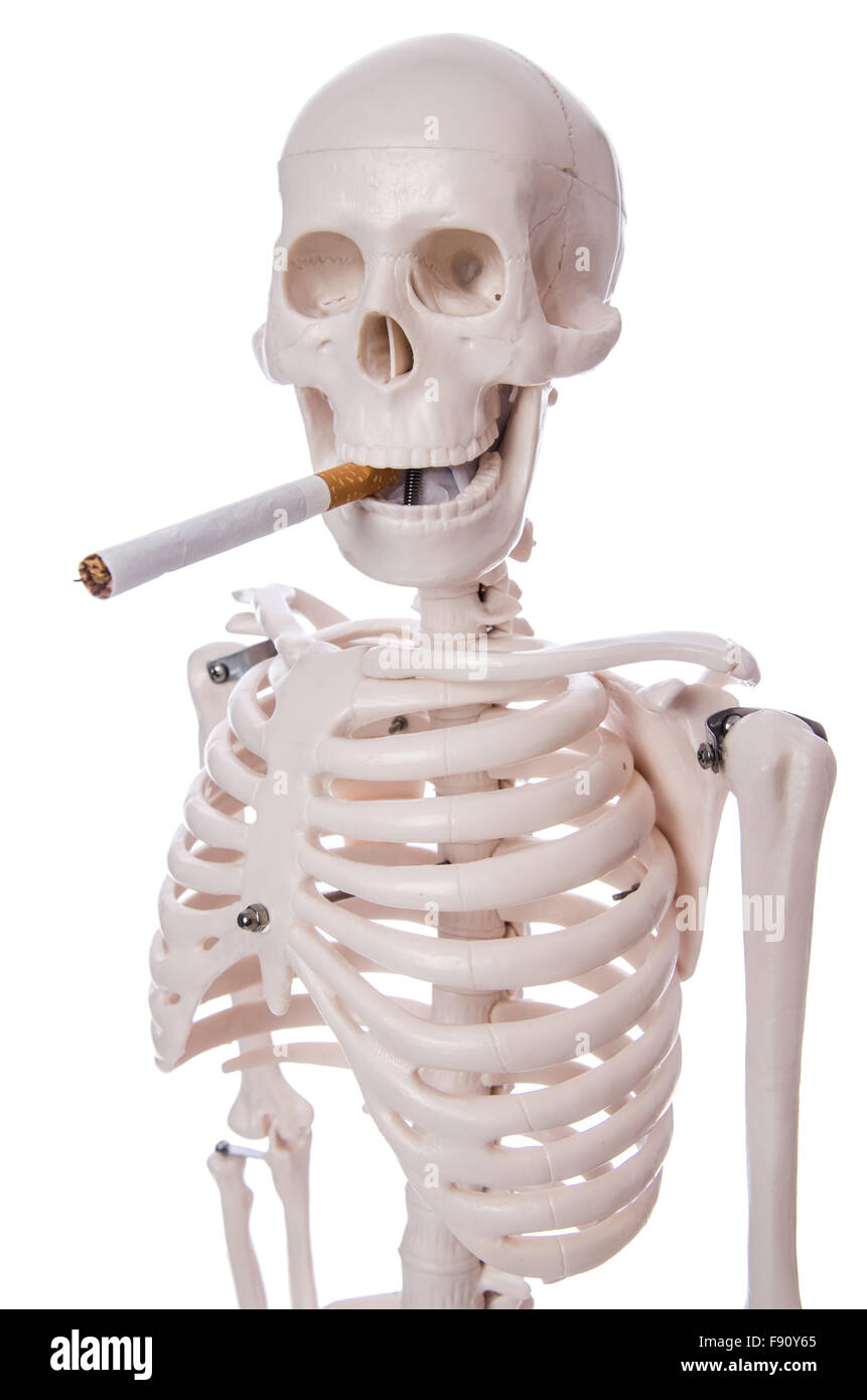 skeleton holding cigarette Skeleton smoking cigarette isolated on white Stock Photo