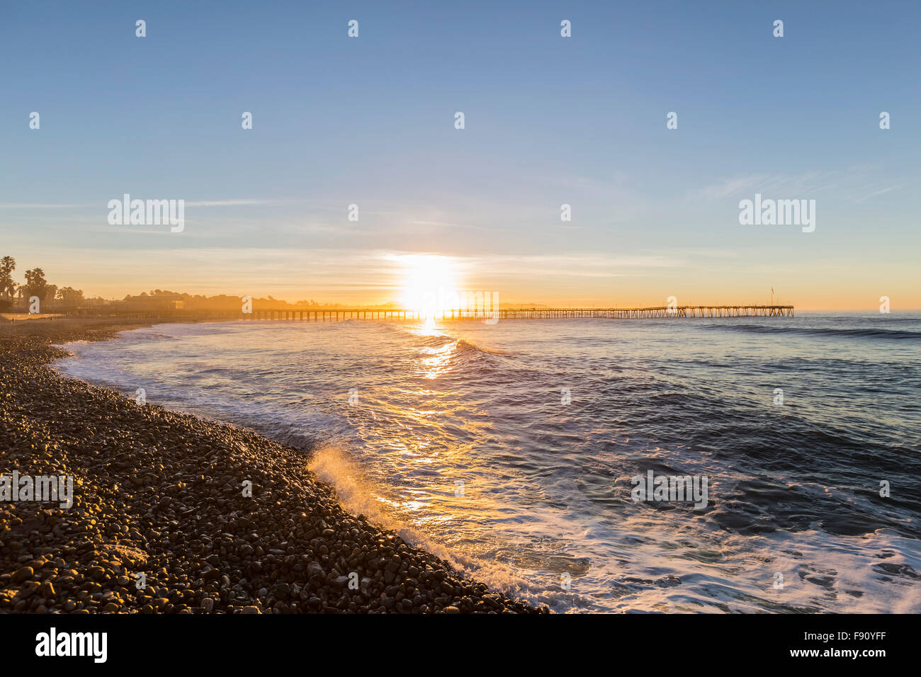 Ventura pier with sunrise surf in Southern California. Stock Photo